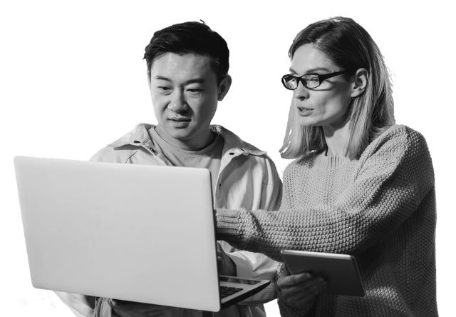 man and woman working on laptop